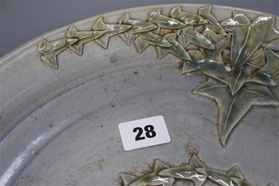 A Studio pottery tray, decorated with ivy leaves, seal mark to rim JC, diameter 35cm